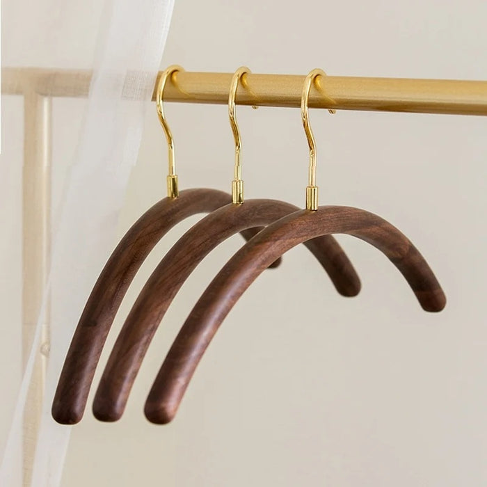 Curved Brass and Black Walnut Wood Clothes Hangers | Coat Hangers | Clothes Hangers | Pant Hangers | Trouser Hangers | Closet Hanger | Wardrobe Hangers | Hangers for Closet | Suit Hangers | Shirt Hangers | Luxury Wardrobe | Stylish Wardrobe | Buy Display Clothes Hangers Online Now at Estilo Living