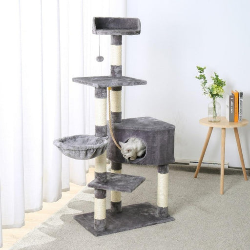 Cute cat inside the corner cat condo of the Cat Nest Tower Climbing Cat Tree with Scratching Posts in Gray color, Buy Cat Tree with Scratching Posts Online Now from Estilo Living
