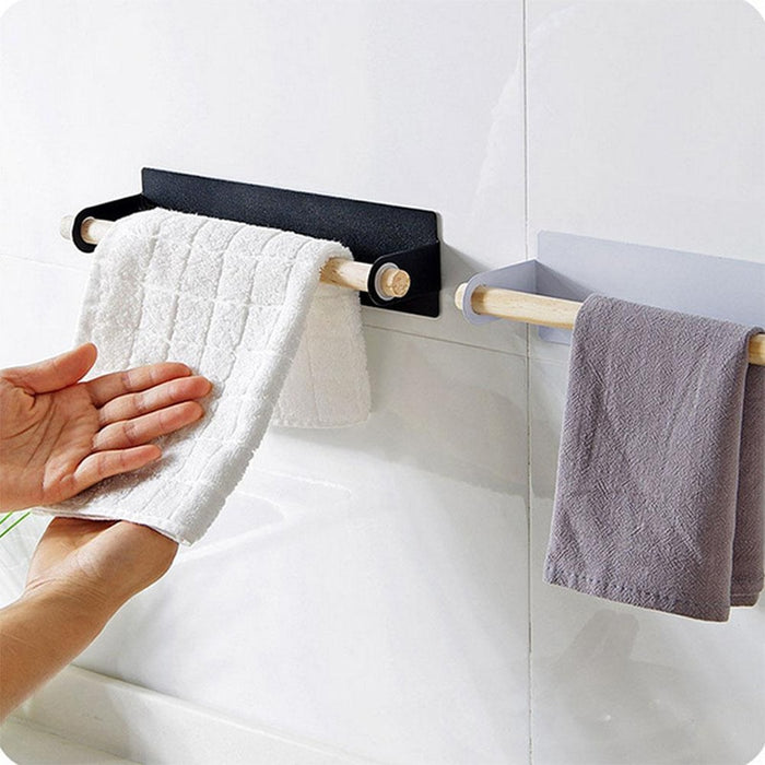 White and Black the Lindsay Towel Rack & Paper Towel Holder with hand towels in the bathroom, from Estilo Living